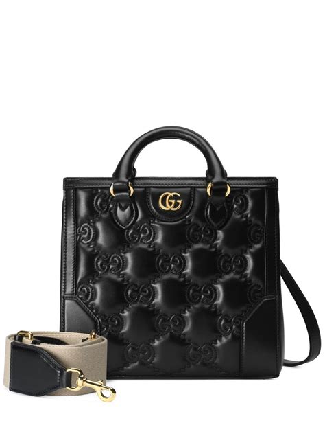 gucci white monogram bag|Gucci black embossed bag.